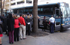 people getting on a bus