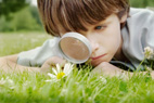 child with magifying glass